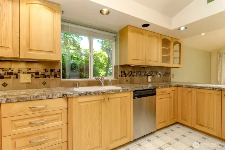 Lovely granite counters and a beautiful backsplash plus undermount lighting. Stainless appliances.