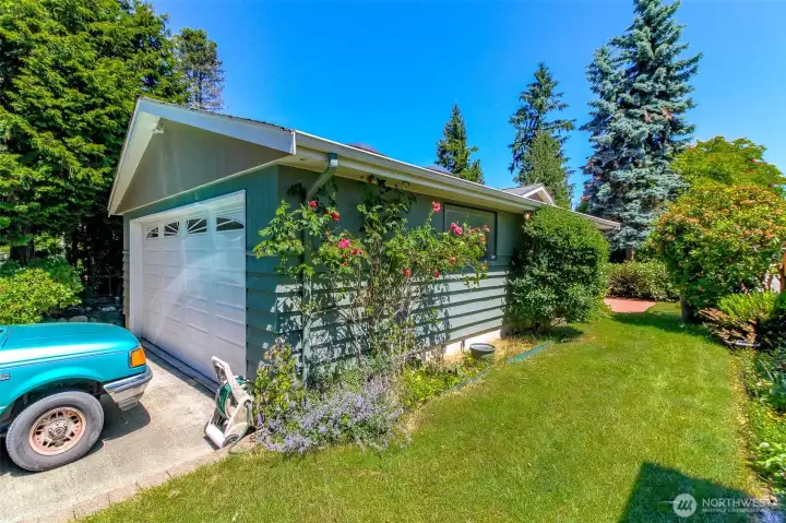 Two car attached garage (570 sq ft) with a driveway parking for two additional cars.