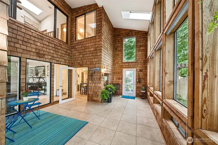 Vaulted ceilings and skylights with large windows inviting the outdoors inside. Vaulted ceilings and skylights with large windows inviting the outdoors inside.
