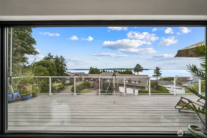 Extra large living room window with views of the Puget Sound. Sunshade to be used when needed. Extra large living room window with views of the Puget Sound. Sunshade to be used when needed.