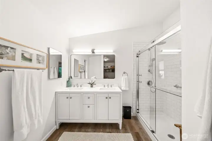 Primary bathroom with walk-in shower and double vanity. Primary bathroom with walk-in shower and double vanity.