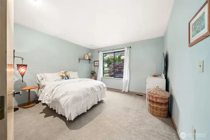 Guest bedroom with views out to the backyard. Guest bedroom with views out to the backyard.