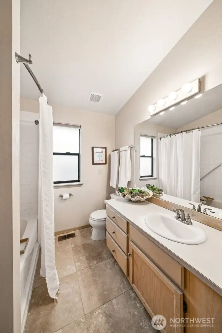Guest bathroom with bathtub/shower combo. Guest bathroom with bathtub/shower combo.