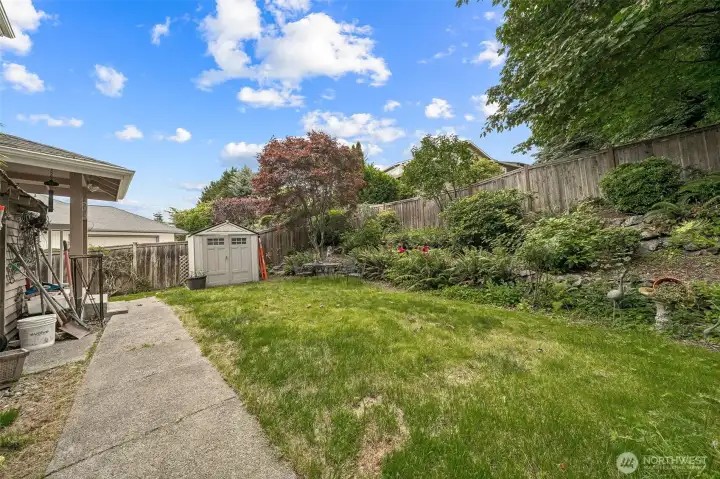 Level backyard with storage shed for tools. Level backyard with storage shed for tools.