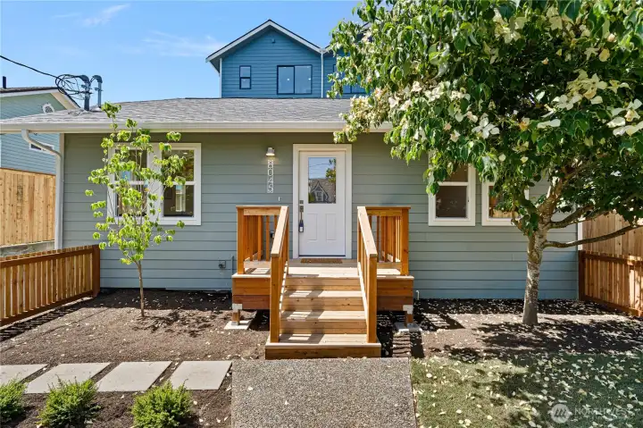 Easy to maintain landscaping in your fully fenced front yard.