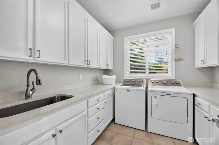 Main Floor Laundry with extra storage. Main Floor Laundry with extra storage.
