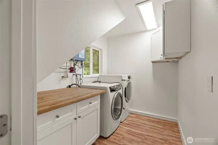 Laundry room with additional storage.
