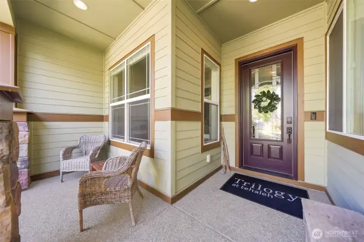 The northeast facing front patio is covered and protected from the weather.