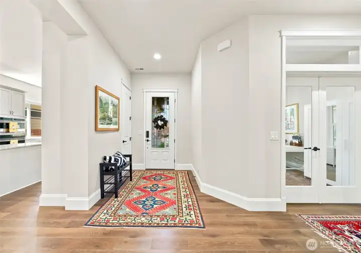 The 8' tall, craftsman glass front door allows light into the foyer while preserving privacy.