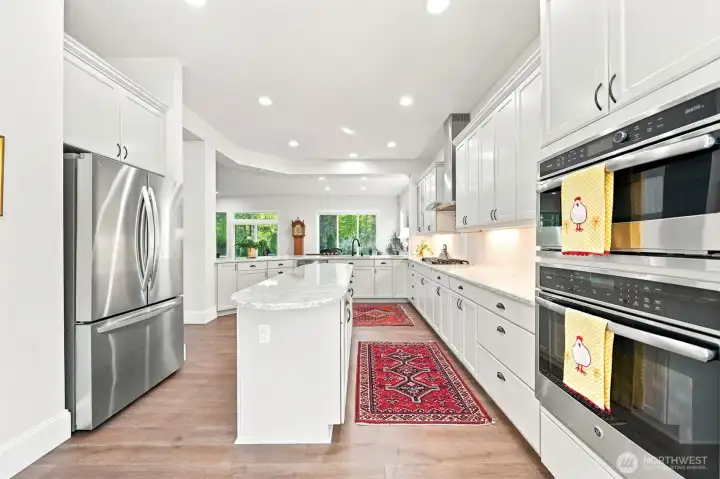 GE Profile double ovens and LG Refrigerator.