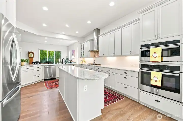 The island is long, offering extra storage and useable counter space. The quartz is beautiful!