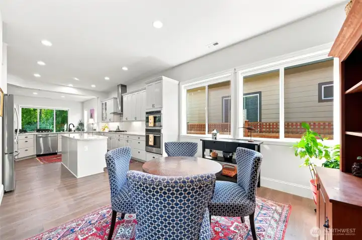 The kitchen is expansive! Double ovens and 5 burner range make hosting and entertaining easy! Bottom up / top down blinds cover all windows.