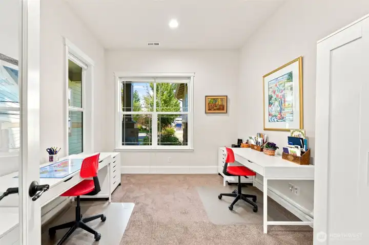 French doors lead into the den (or guest space) with 2 walls of windows. The home has top down / bottom up window coverings that can be positioned to allow light in, but still ensure privacy when desired.