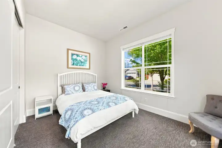 The second bedroom is on the opposite side of the home from the primary so it's an ideal space for guests, with an adjacent full bathroom.