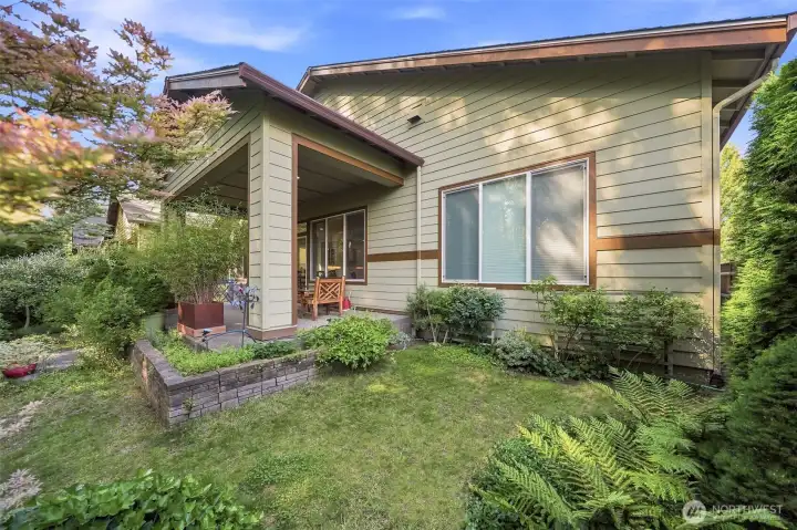 The backyard is natural and blends in seamlessly with the preservation area behind the house.