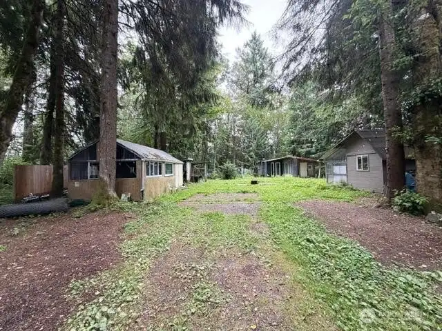 Left building includes kitchen & wood stove, middle rear structure is considered to be the Main House, structure on the right is the Secondary Dwelling Left building includes kitchen & wood stove, middle rear structure is considered to be the Main House, structure on the right is the Secondary Dwelling