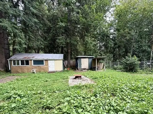 Left structure contains kitchen & wood burning stove, right structure is a storage shed Left structure contains kitchen & wood burning stove, right structure is a storage shed