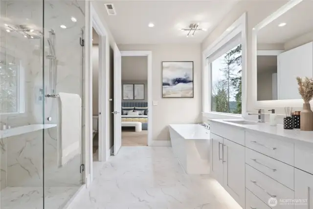 Sumptuous bathroom features large soaking tub and walk in tiled shower.
