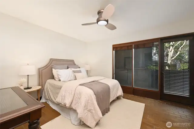 Primary Bedroom with access to back patio.