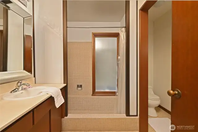 With mad-men like vibe that features a sunken tub.