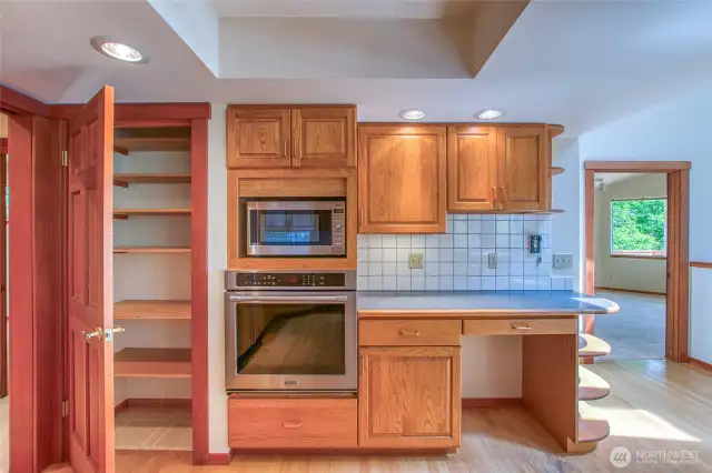 There is a large pantry and a desk area.