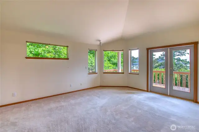 Primary ensuite with a walk in closet with water views.