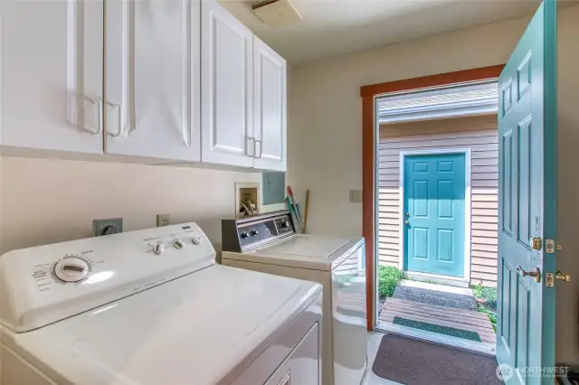 Laundry room with an exterior door leading to the detached garage.