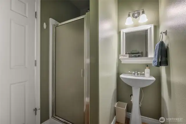 Main floor bathroom by garage door