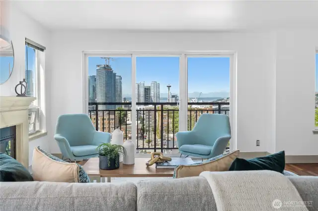 Cozy up by the gas fireplace and take in city views through French balcony and oversized windows.