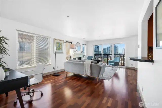 Relax or entertain in style with wide city views and warm, west-facing light.