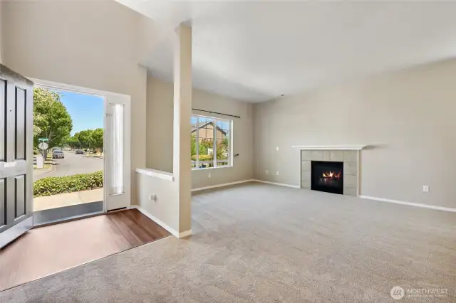 Sizable living room with cozy gas fireplace. All new carpet on lower level.
