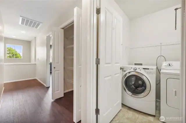 Linen closet and dedicated laundry area conveniently located in the hallway between the bedrooms—all on the second floor for easy access