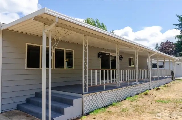 Large, covered porch runs the full length of the home.