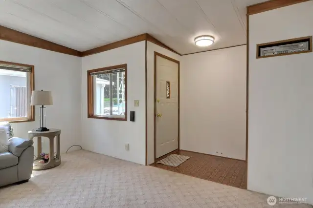 Front foyer steps into the living room where you'll find fresh paint throughout the home.