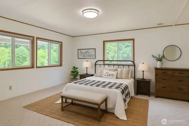 Very generous primary bedroom with lots of natural light and plenty of room for all your bedroom furniture.