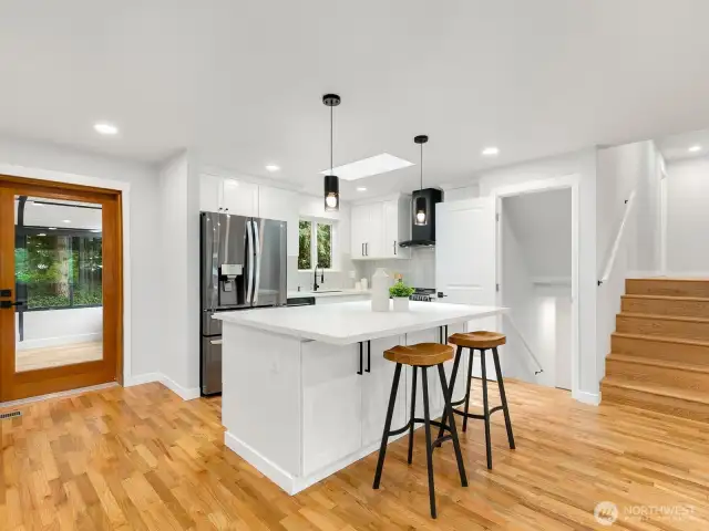 Modern cabinets with quartz countertops.