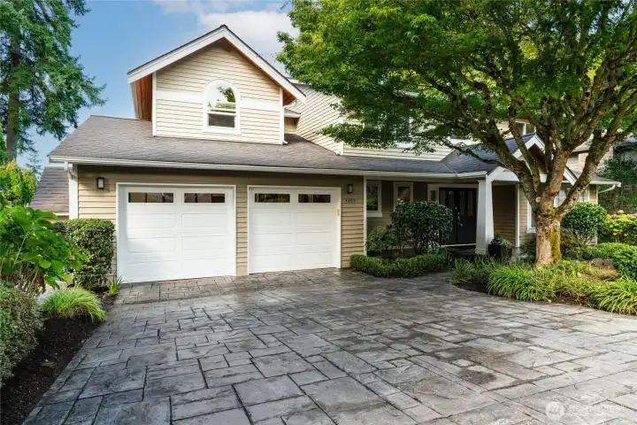 Impressive on approach, stamped concrete driveway and  walkway, offering cobblestone feel