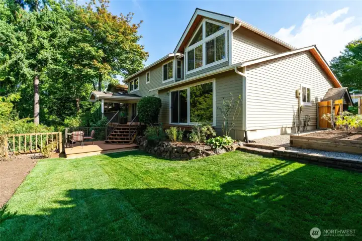 Level backyard fenced area, overlooks lower terraced yard with endless possibilities