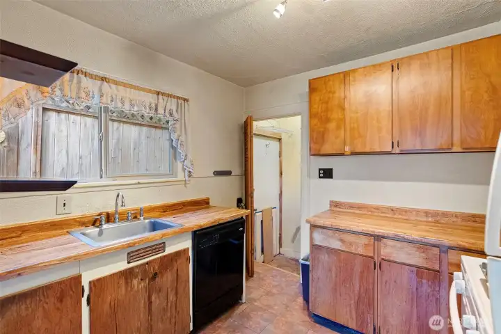 Access to the Attic, Basement and Back door off of the Kitchen