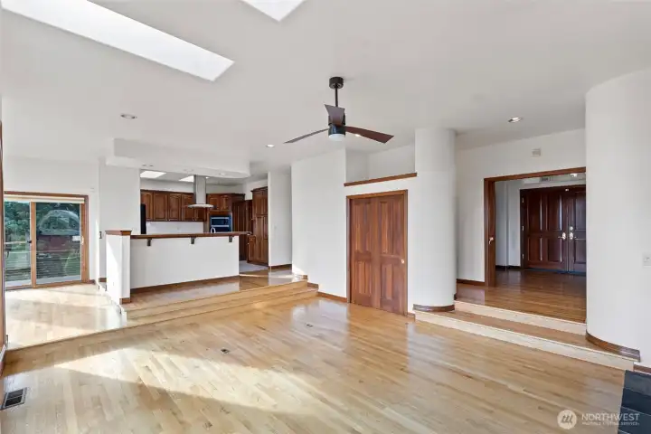 A look from the Great Room looking back towards the kitchen and front entrance to the right.