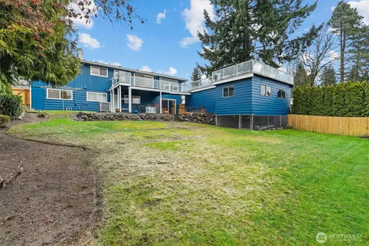 Spacious backyard with open lawn