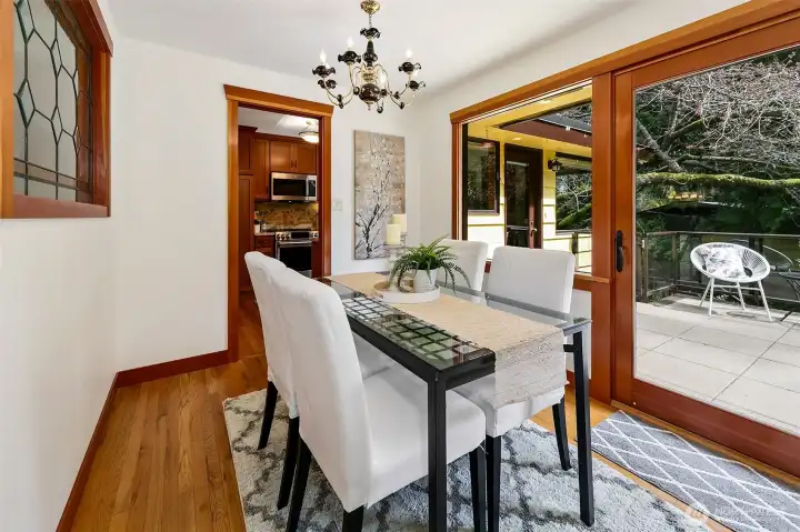 Dining area with oversized slider to expansive deck