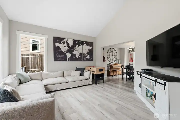 Living room with vaulted ceilings.
