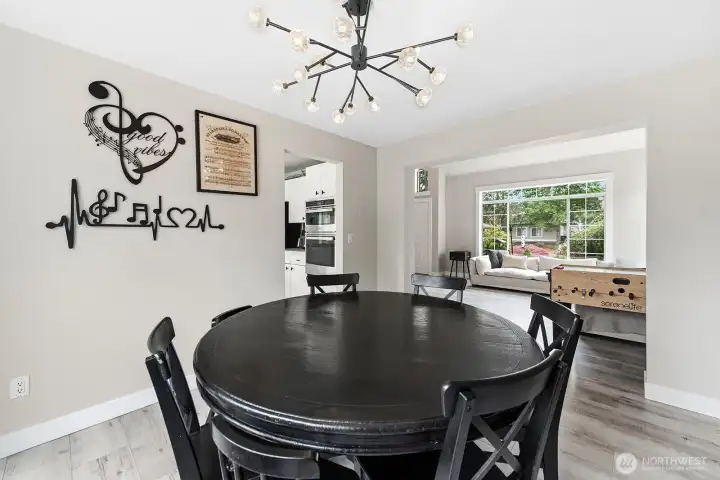 Dining room opens up into the vaulted ceiling living room allowing natural light to flow through both spaces.