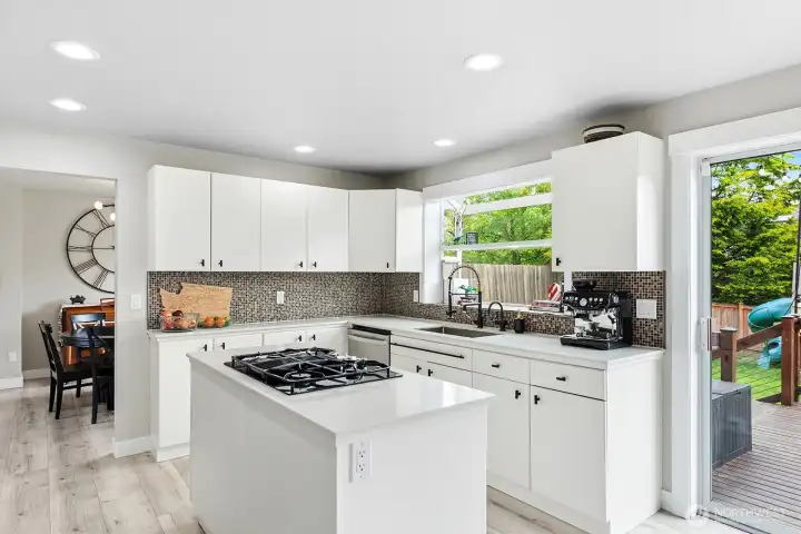 Kitchen island with gas cook top.