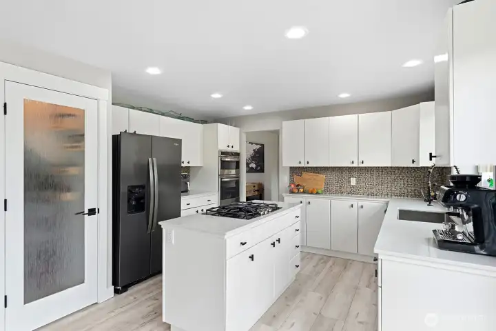 Kitchen offering alot of storage in cabinets and walk in pantry
