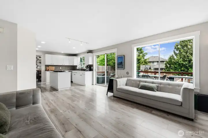 Family Room, looking into Kitchen with slider leading to deck in the backyard.
