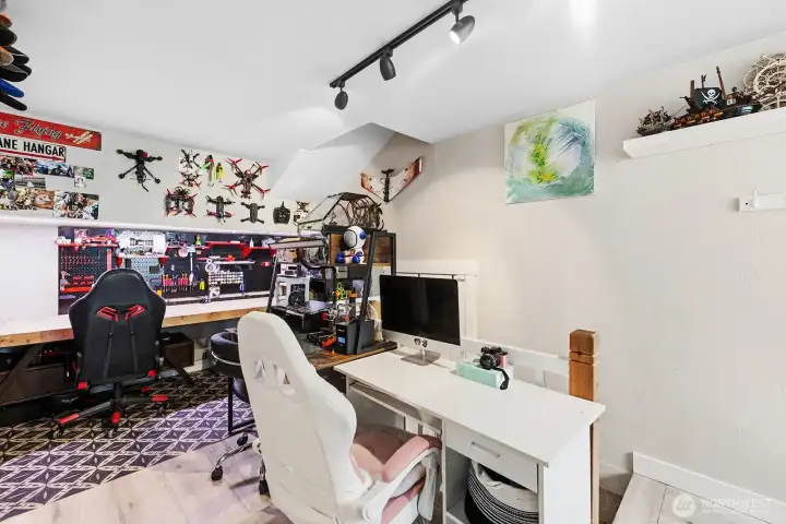 Maker room or office with access to the garagae and walk way into the main level of the home.