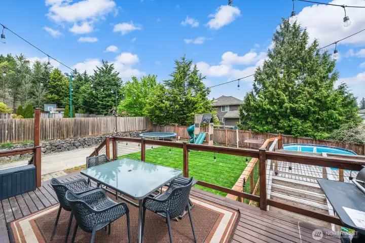 Slider from kitchen leads to newly refinished deck.