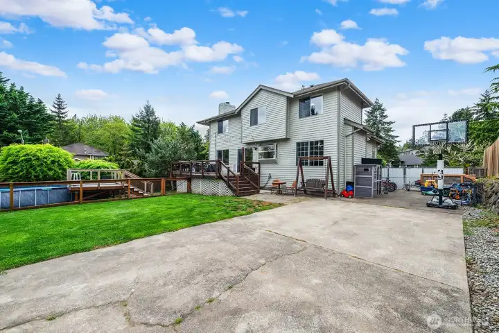 Corner lot offers lots of natural light and privacy and the community includes mature trees in the distance.